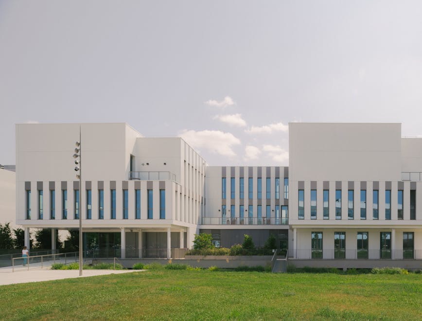 architecture building office building grass plant lawn campus person