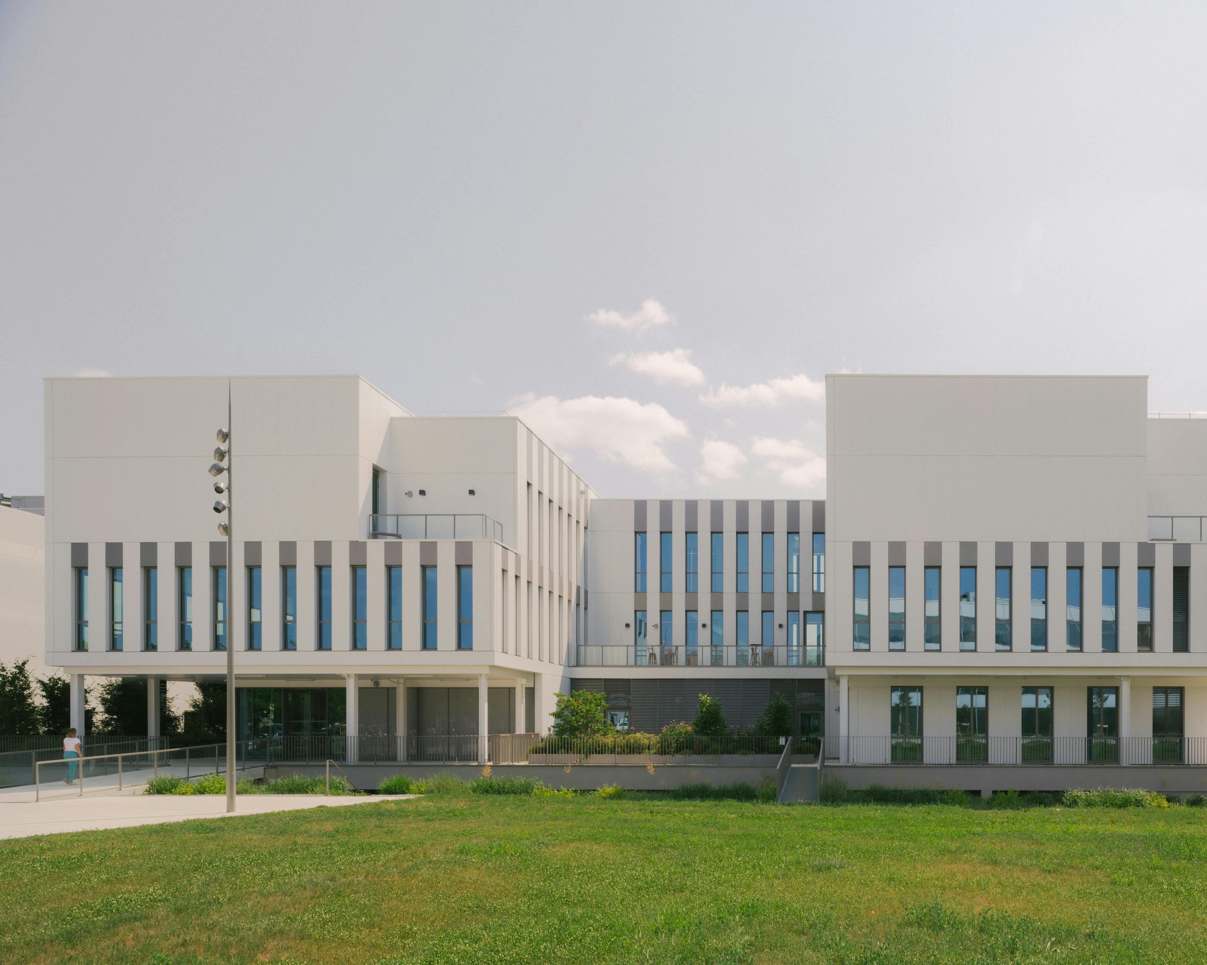 architecture building office building grass plant lawn campus person